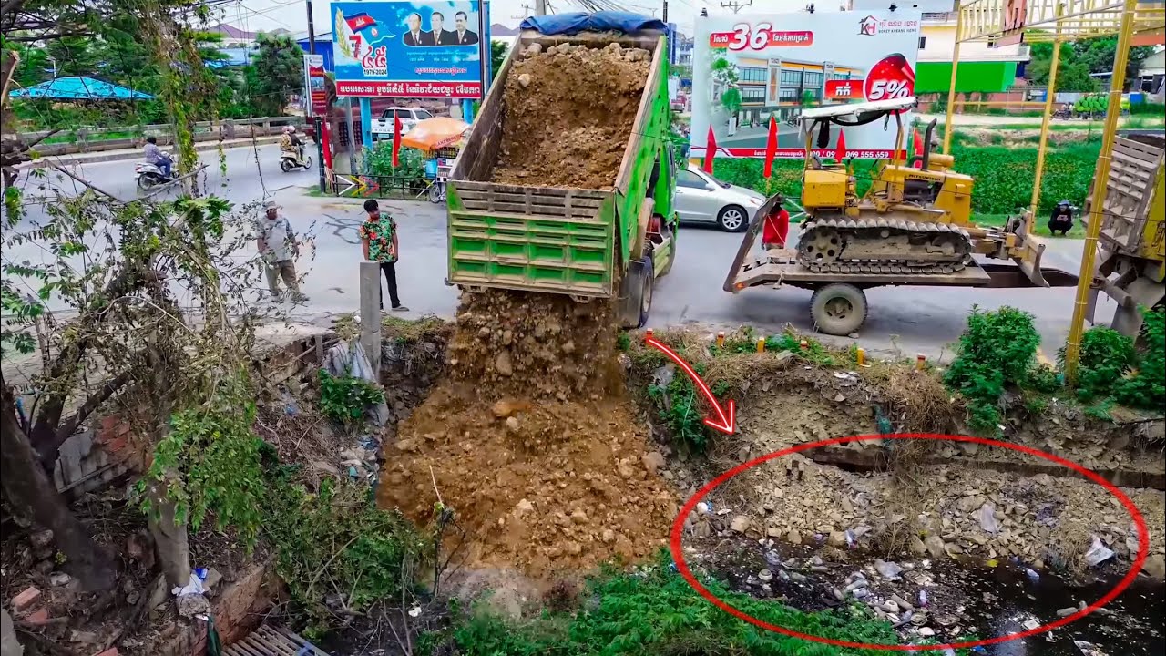 Amazing Start New Project!! Dump Truck Operate Unloading Soil Fill The Canal With Mini Dozer Pushed