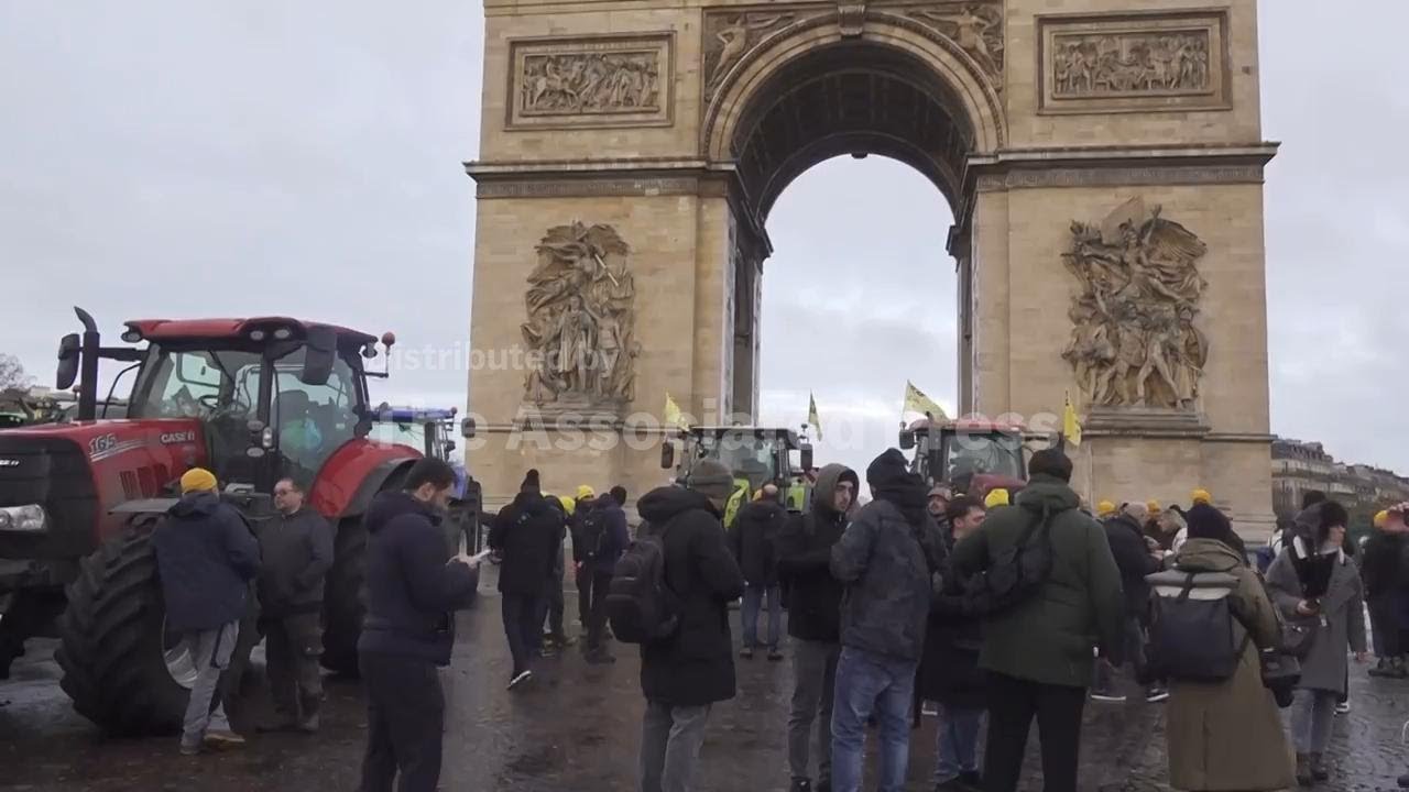 French farmers gather in front of the Arc de Triomphe with tractors to protest Mercosur deal