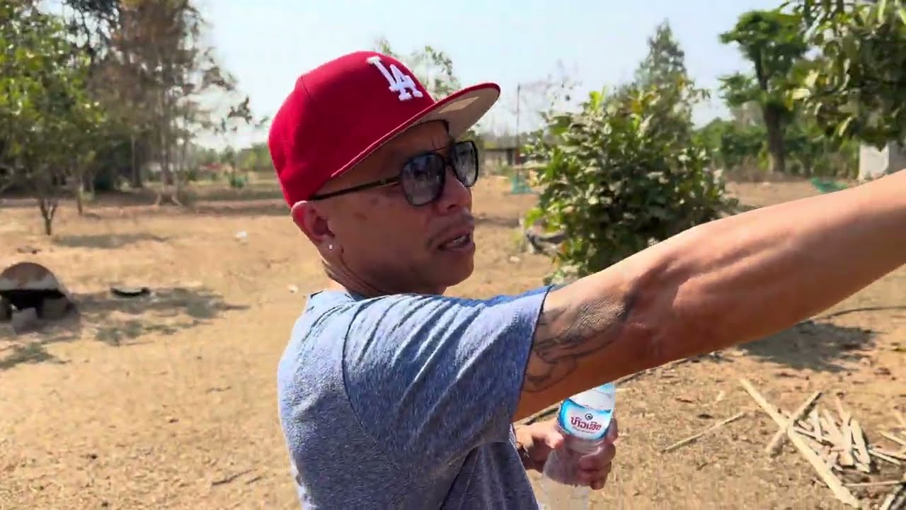 Go play with Mr. Lai...the owner of Lao Town in Fresno California who came to visit Laos.