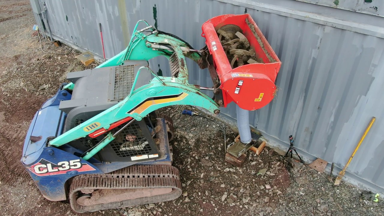 Setting up the IHI track loader to run a cement mixer