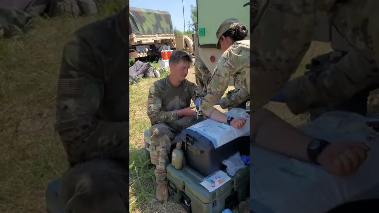Soldier receiving IV fluids for hydration