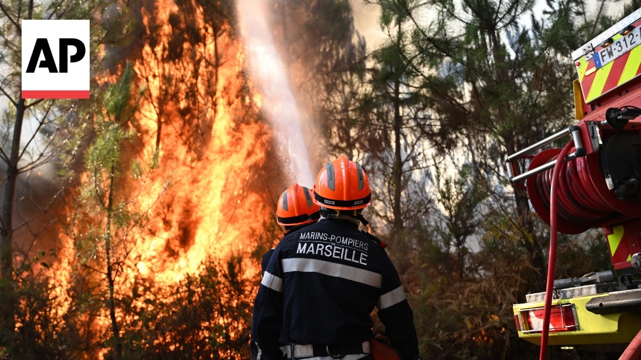 Firefighters battle wildfires in forests west of Bordeaux in France