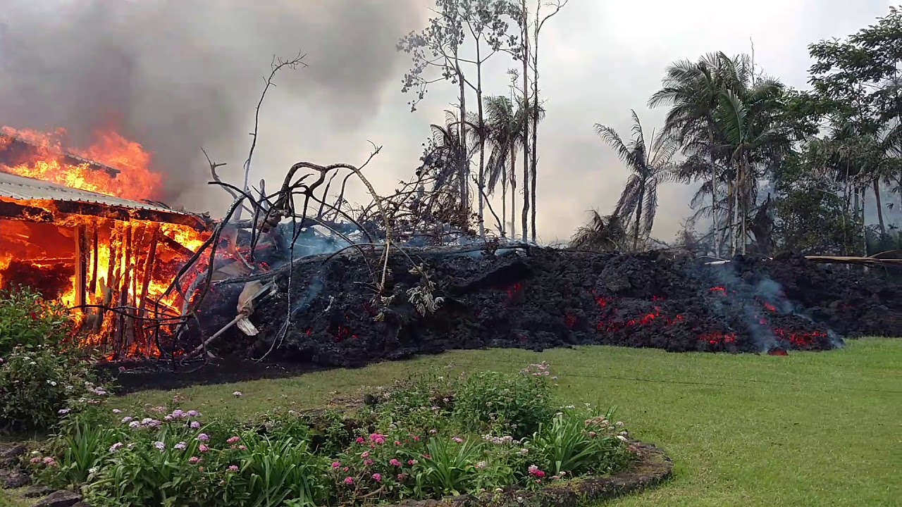Lava overtakes house in Leilani Estates, Hawaii. May 6, 2018