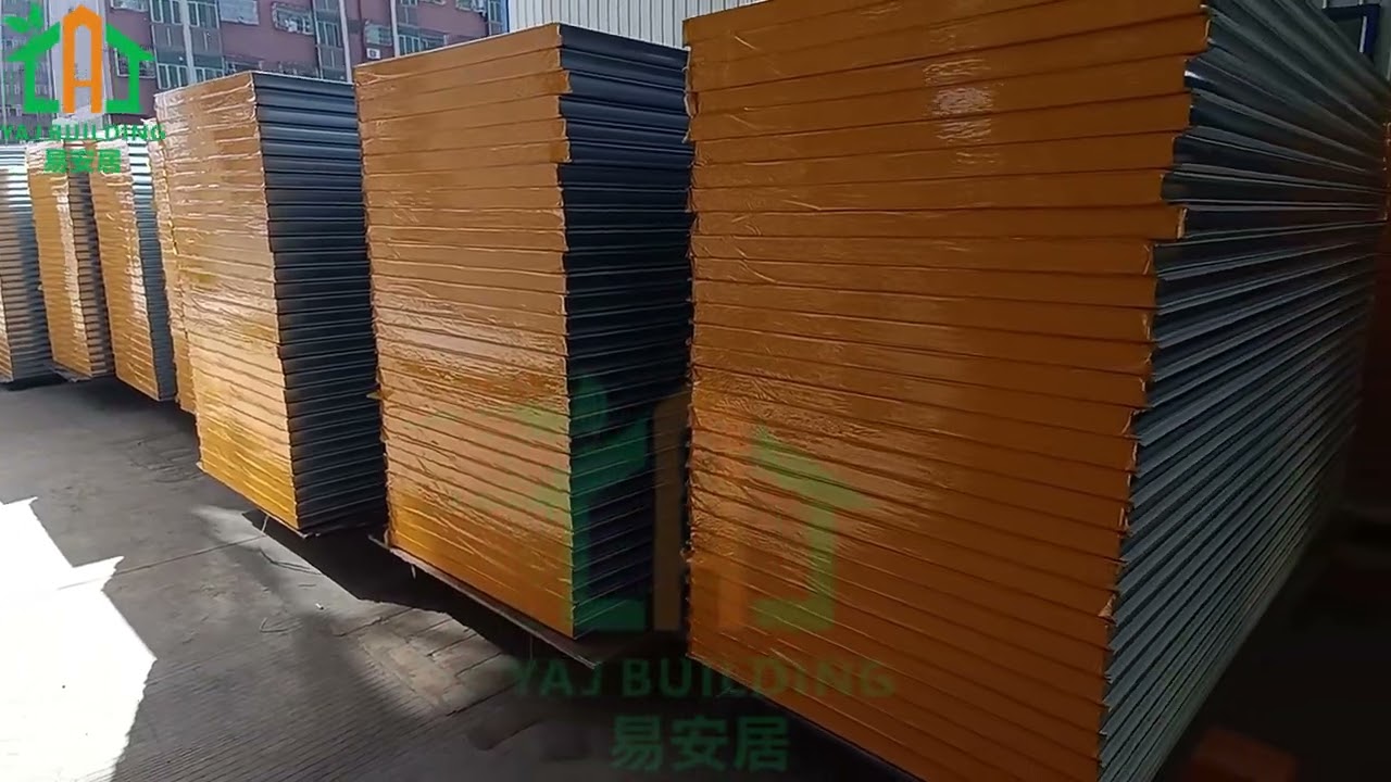 The factory has specialized machines and workers for manufacturing sandwich panels.