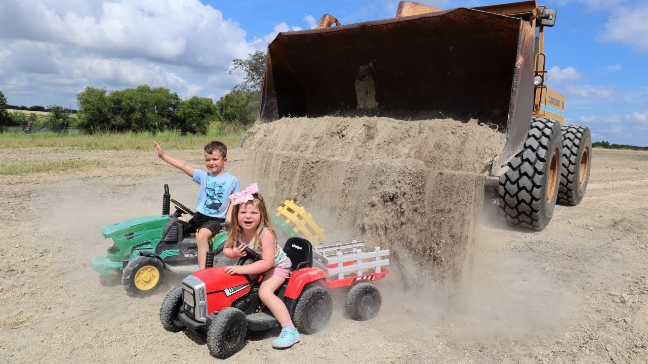 Using kids tractors and real tractors to dig dirt | Playing in dirt and water | Tractors for kids