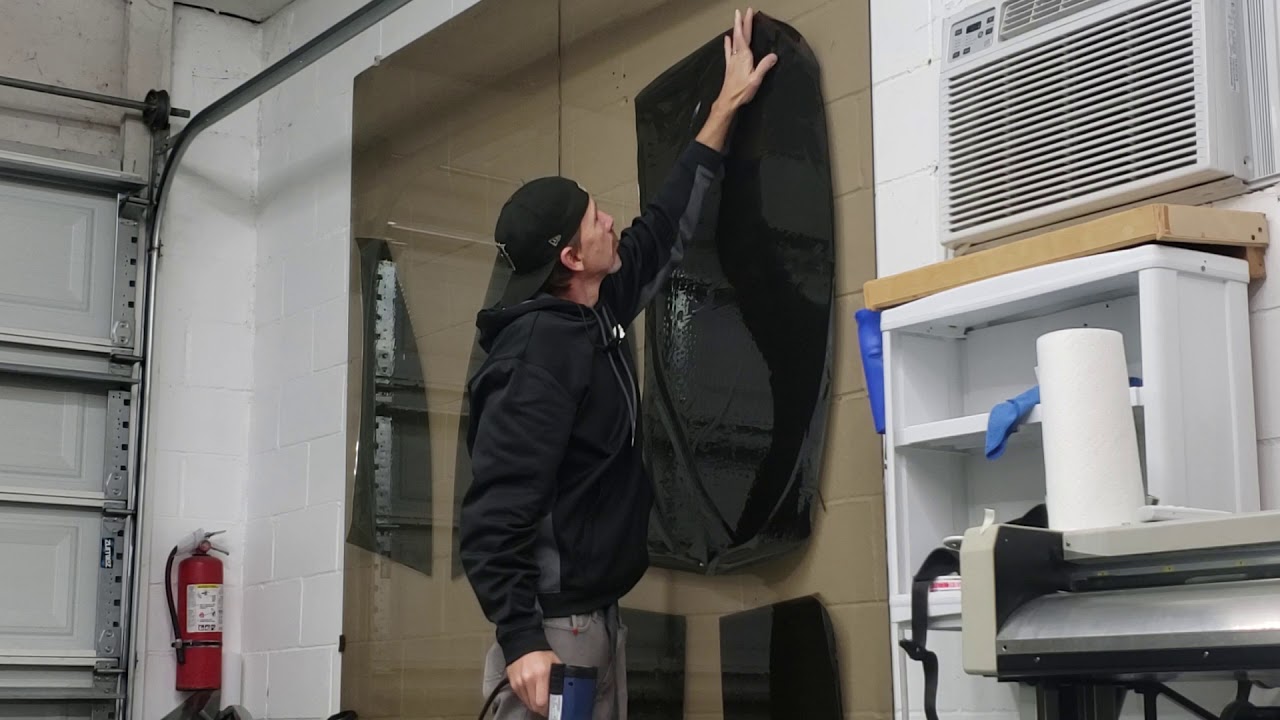 Window film shrinking on a wall