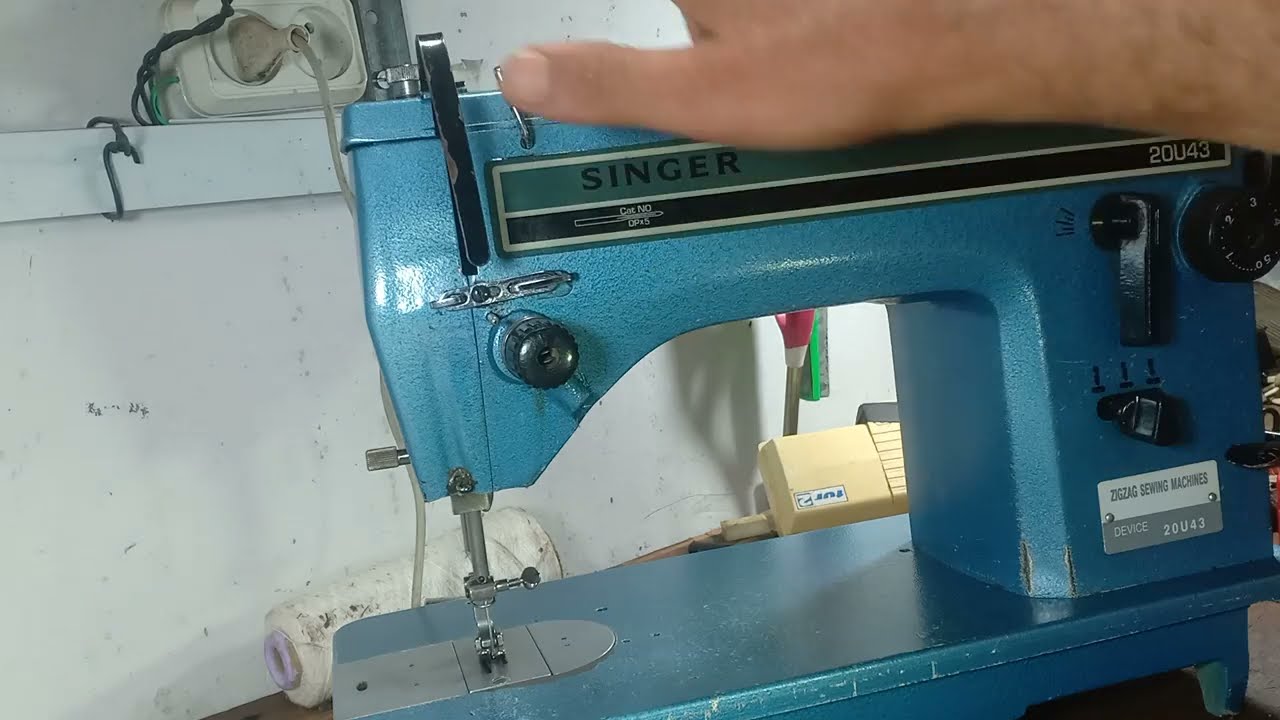 SINGER.20U43 .comment réparer la  tension