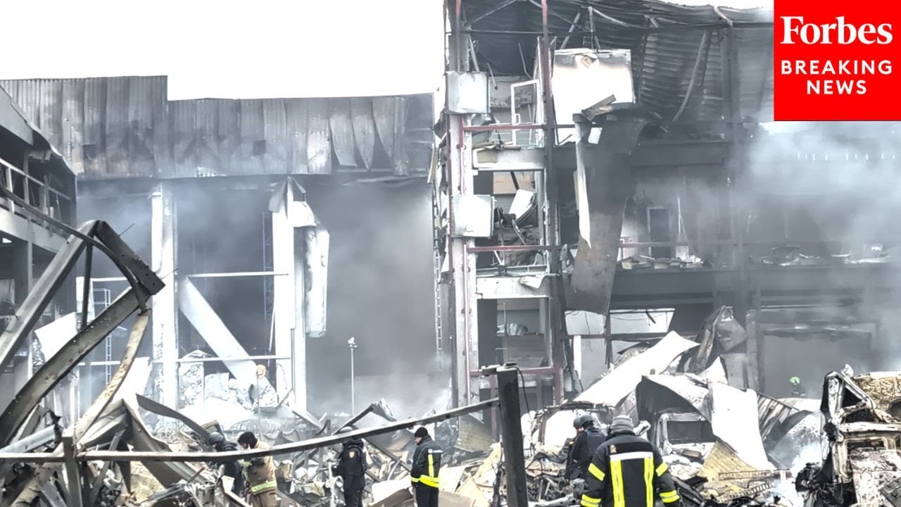 First Responders Deal With Aftermath Of Russian Ballistic Missile Attack On Kyiv, Ukraine