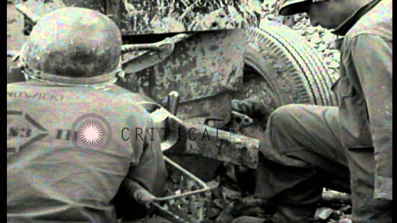 Gun crew of US 383rd Regiment,96th Army Division fire 37 mm anti tank gun on Shur...HD Stock Footage