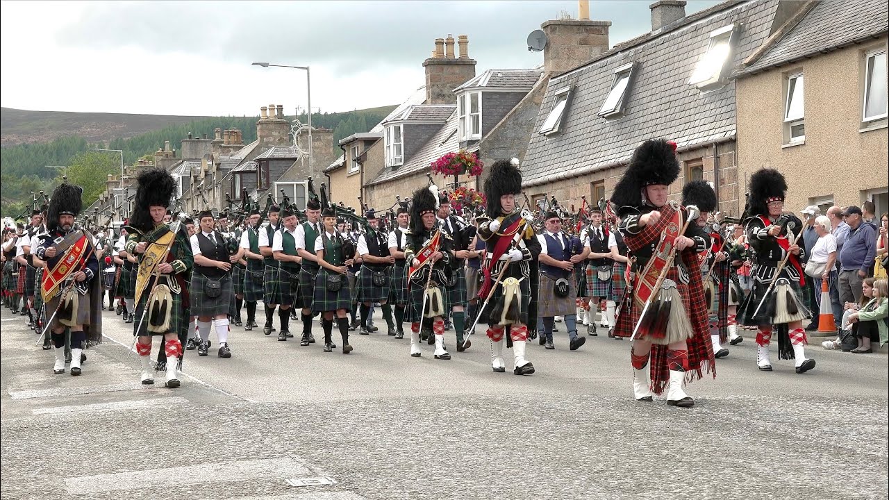Thundering sound of the Massed Pipes and Drums marching after the 2022 Dufftown Highland Games