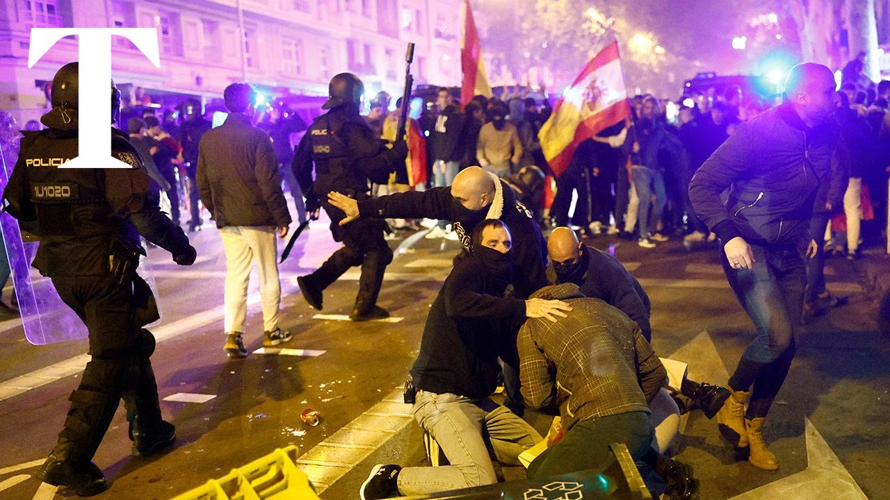 Spanish protesters opposed to Catalan amnesty bill clash with riot police in Madrid