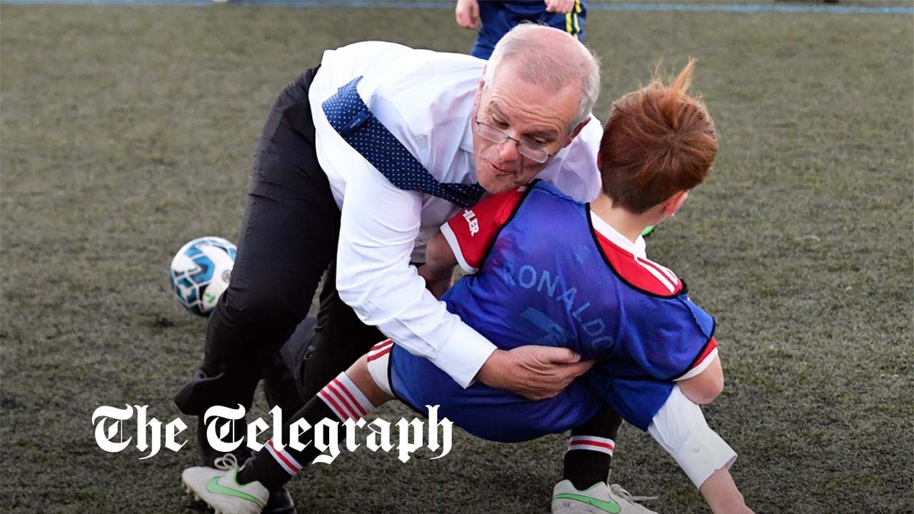 Aussie PM tackles a child in football game on campaign trail