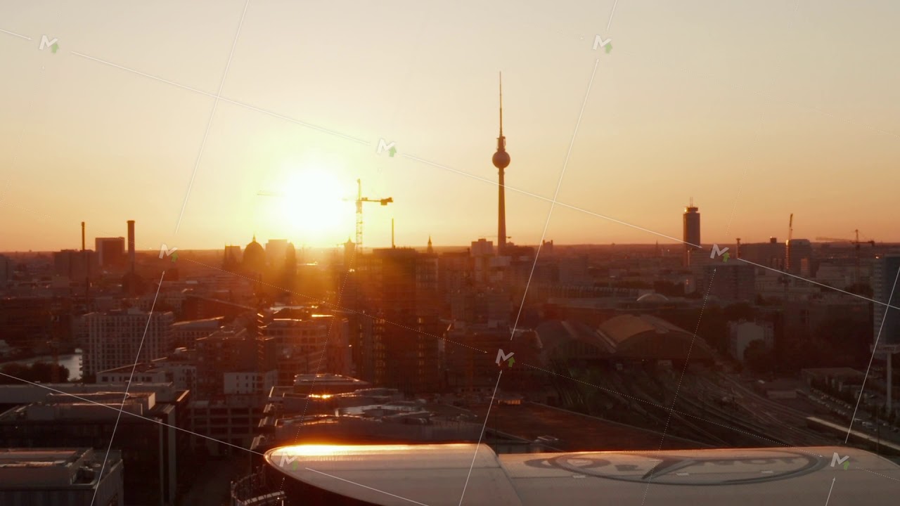 AERIAL: Flight over Berlin, Germany at beautiful Sunset, Sunlight and view on Alexanderplatz TV