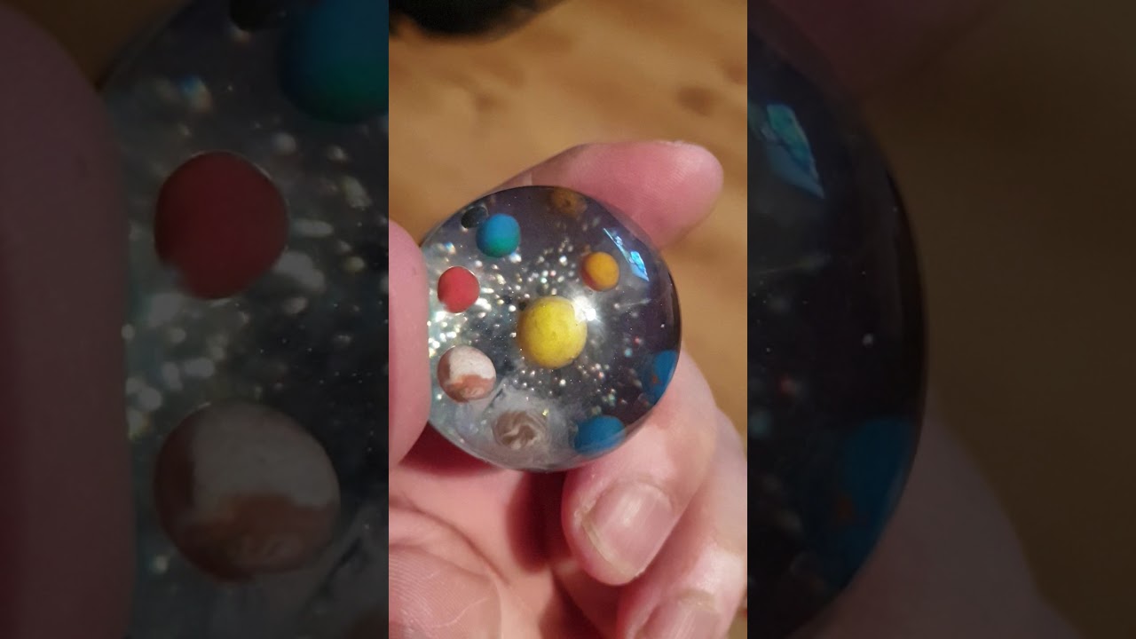 epoxy resin solar system sphere with moon and pluto
