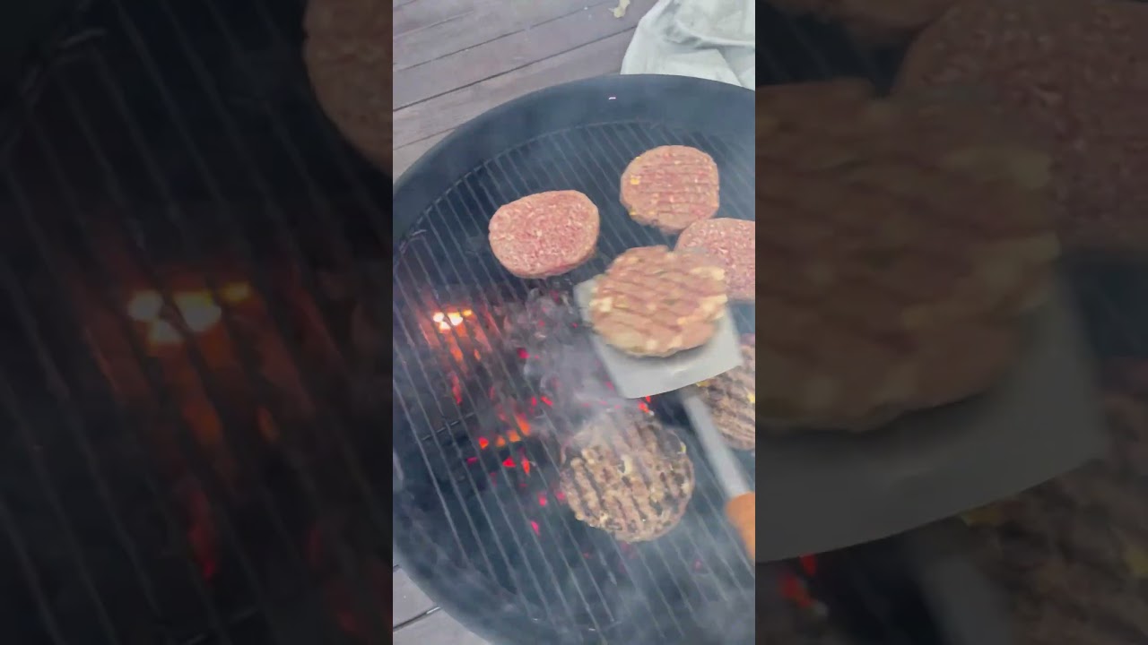 Grilling burgers on Weber charcoal grill! 🍔