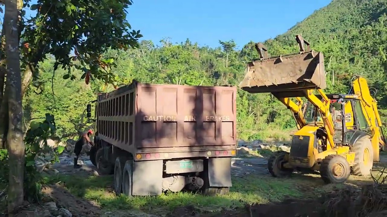 Cleaning up the river side before the heavy flooding comes again 