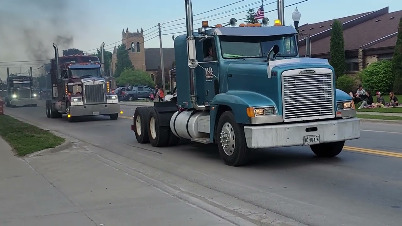 Watching the Great Lakes Big Rig Challenge 2024 parade through Onaway with James and Samuel!