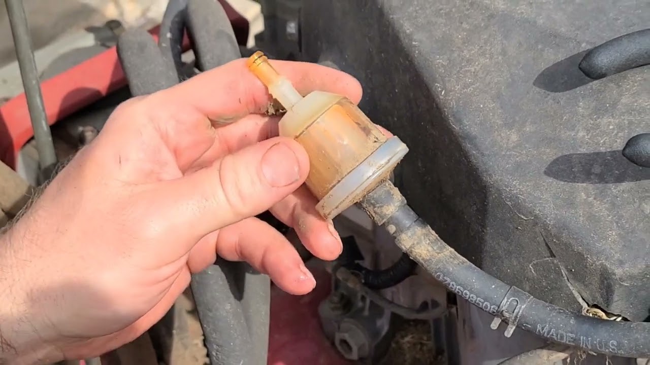 Changing the fuel filter on Exmark Turf Trace Hp. Spring lawn mower maintenance.