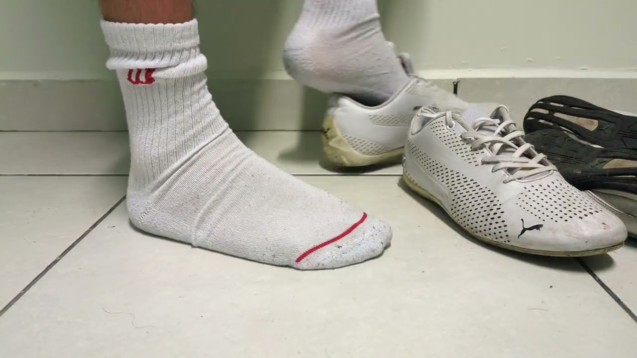 Stomping old Puma Drift Cat on white socks and bare feet