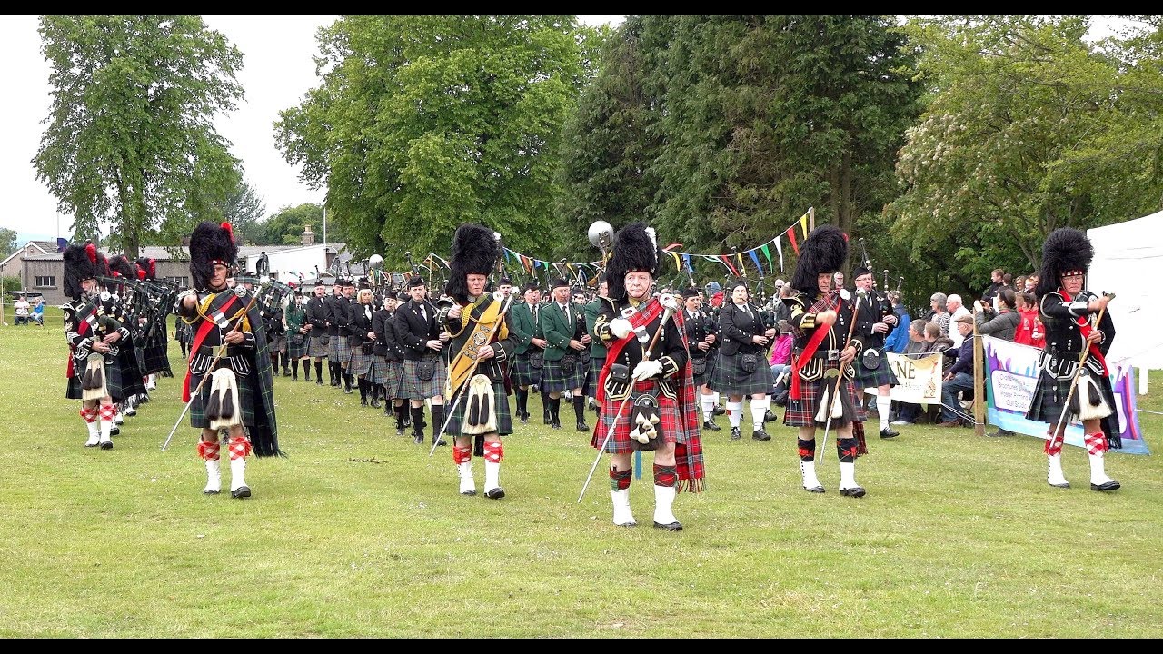 Opening parade of Oldmeldrum Highland Games with the Massed Pipes and Drums, June 2018 - in 4K