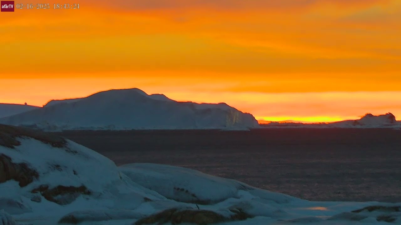 Feb 16, 2025: Sunset in Greenland with Large Iceberg Drifting by