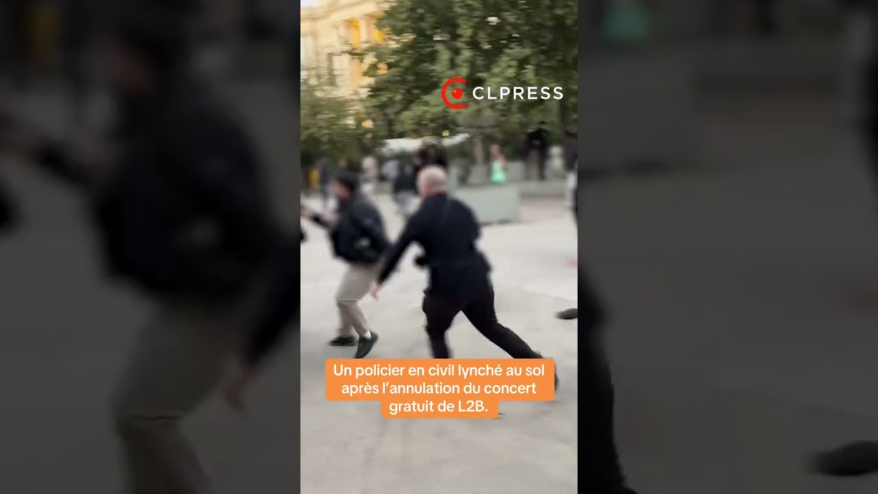 Un policier lynch&eacute; au sol par des fans du groupe rap L2B lors des d&eacute;bordements &agrave; Paris