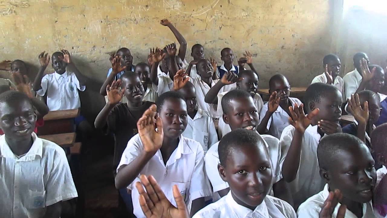Children singing The Green and Red of Mayo in Uganda