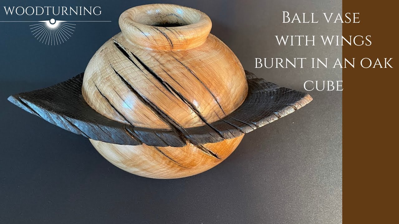 woodturning ball vase with wings burnt in an oak cube