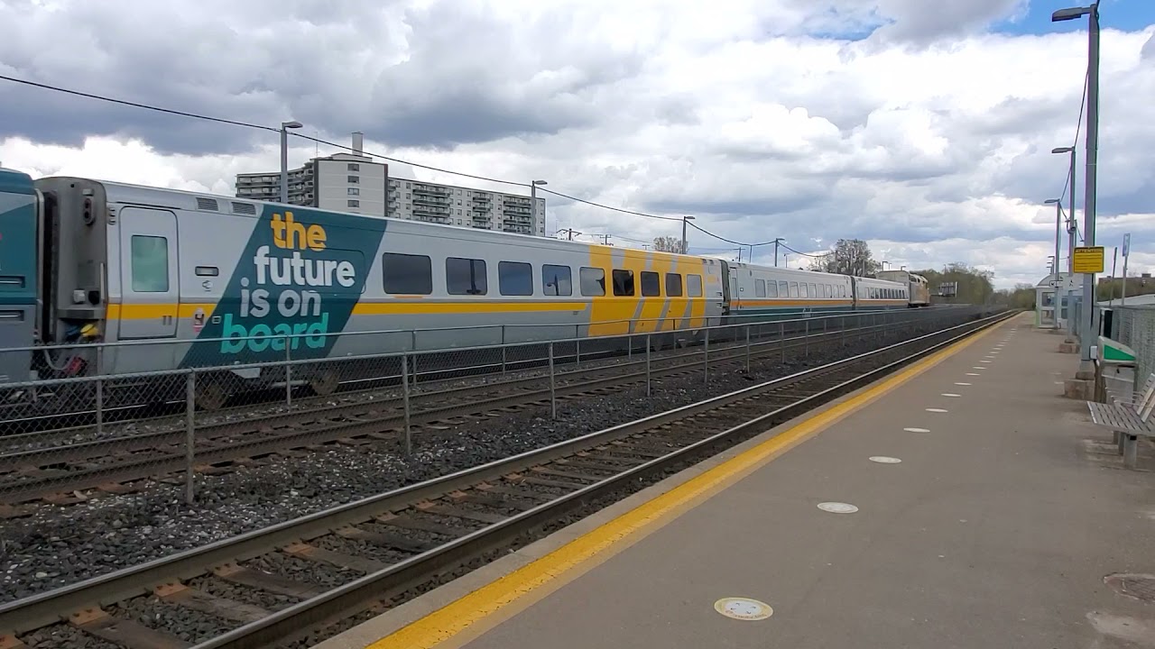 VIA Rail train passing by at Eglinton GO station