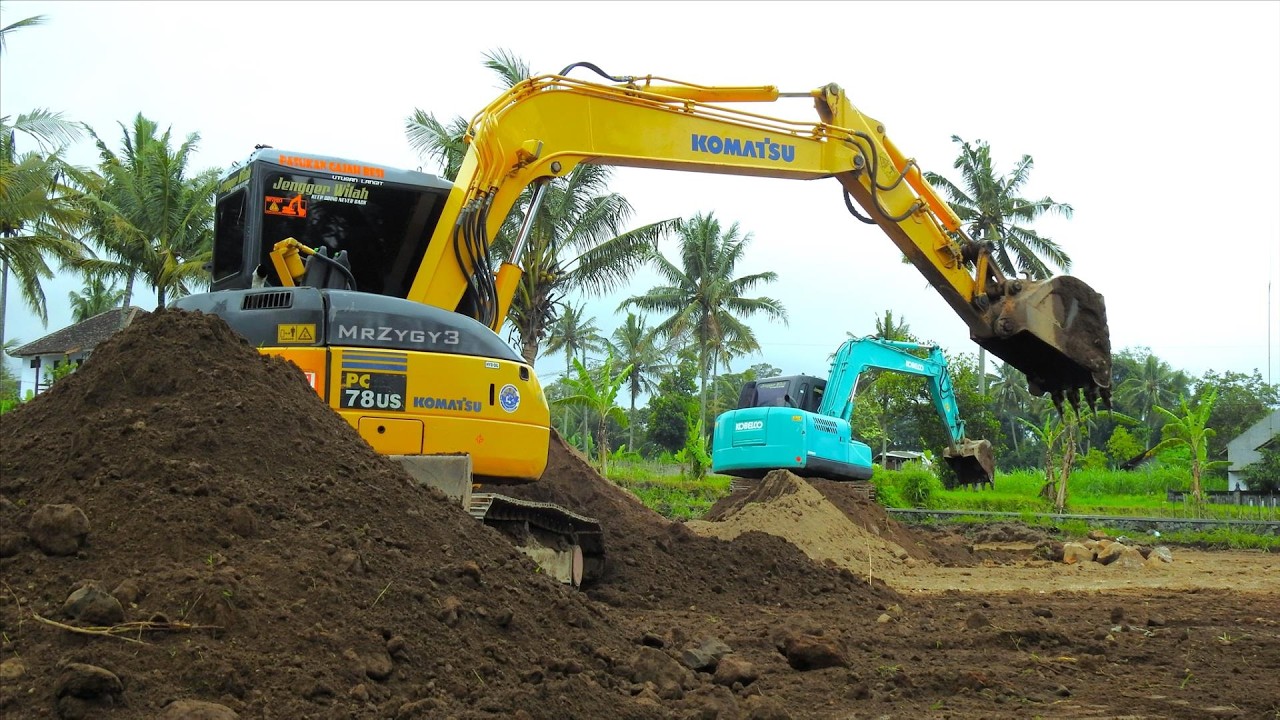 Kobelco And Komatsu Mini Excavator Working in a Row: Landscaping and Dirt Movement