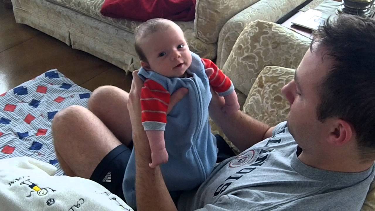Baby Liam at 8 weeks old, laughing and smiling