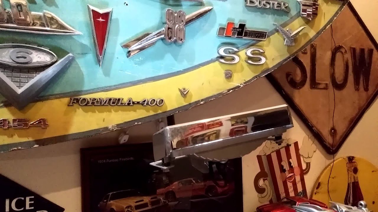 Gas Station sign with custom lighting and vintage car emblems