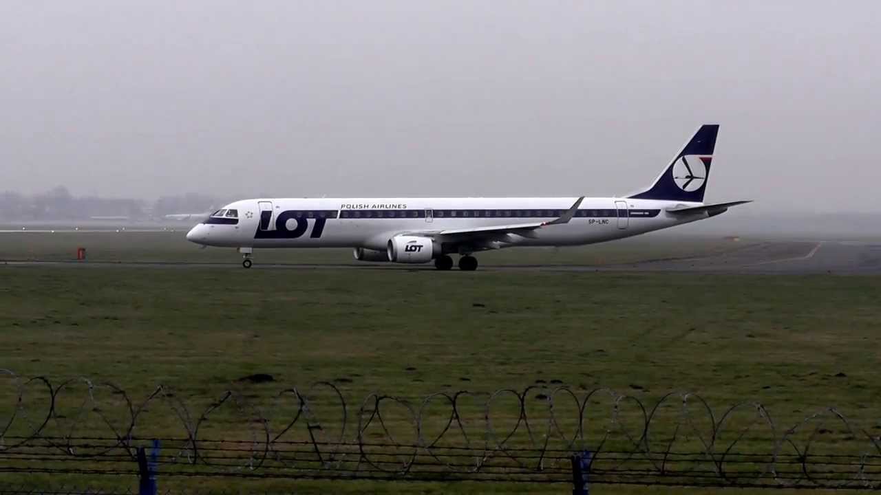 LOT Polish Airlines Embraer 195 take off at RWY 11 Warsaw Okecie
