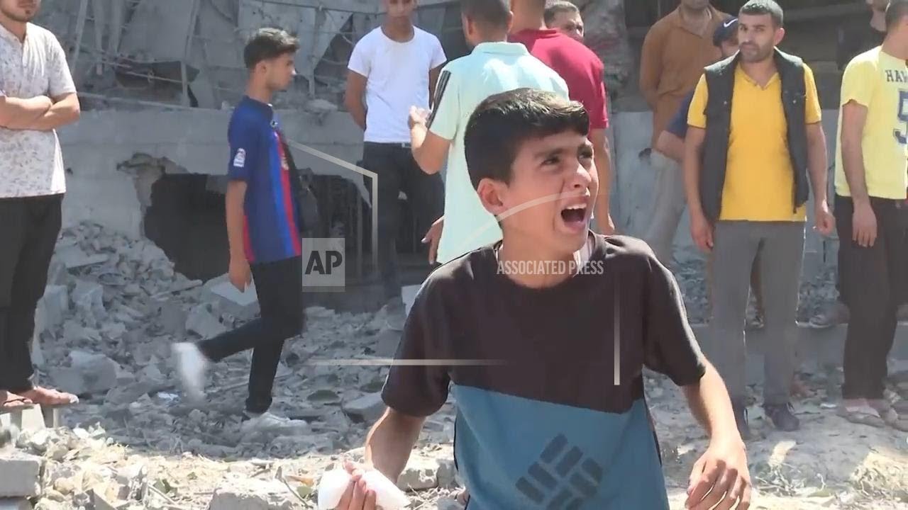 Palestinians survey rubble left in aftermath of Israeli strike on Deir al-Balah in central Gaza