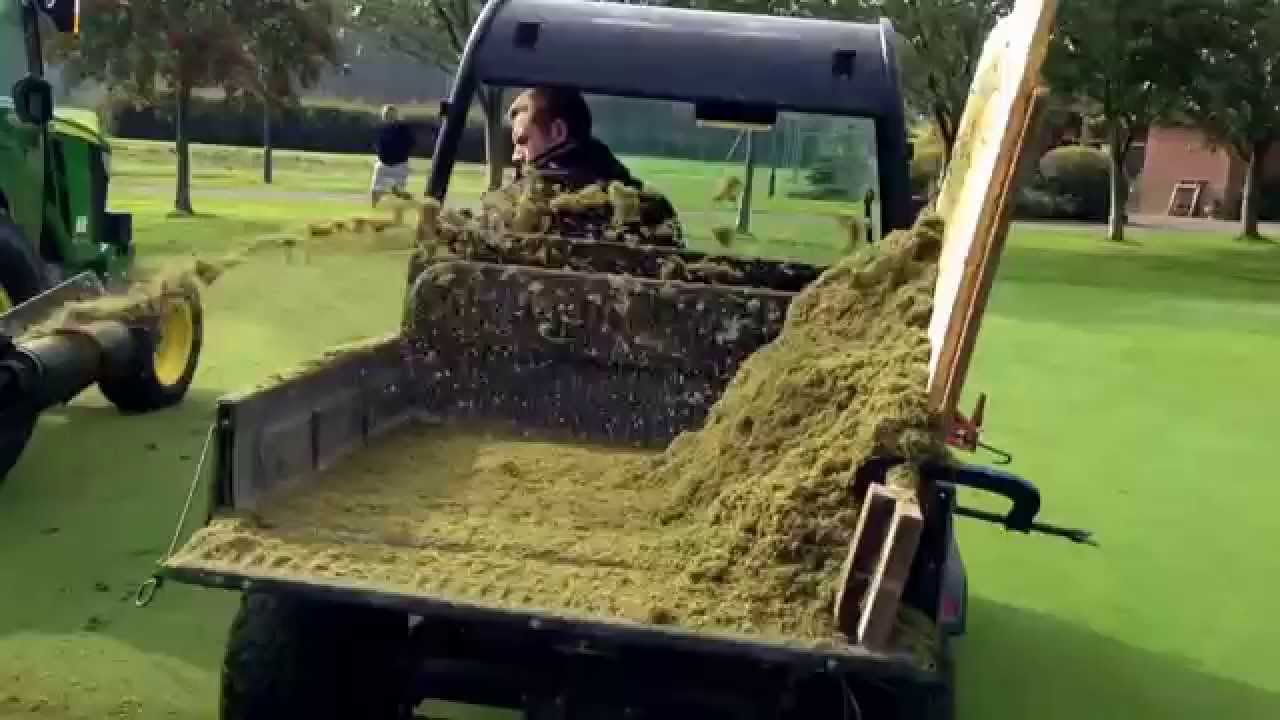 Deep scarifying putting green