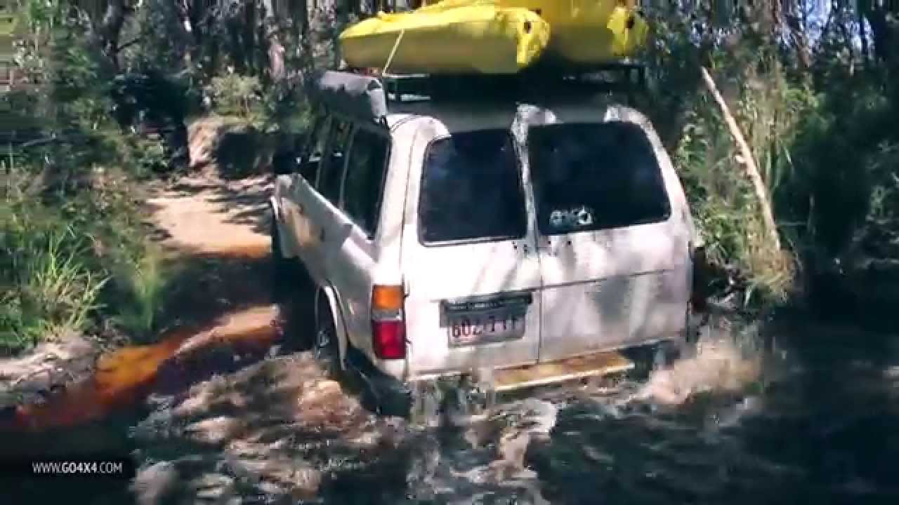 Bogged Toyota Land Cruiser recovered by Jeep Wrangler on Stradbroke Island