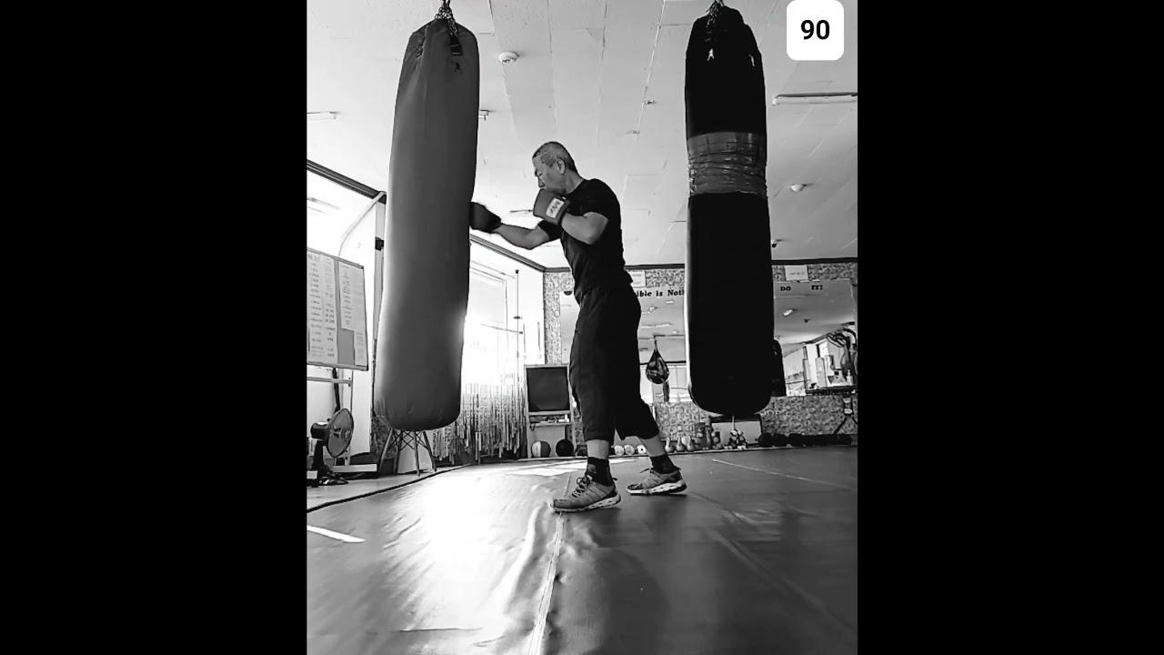 practicing how to hit the sandbag 