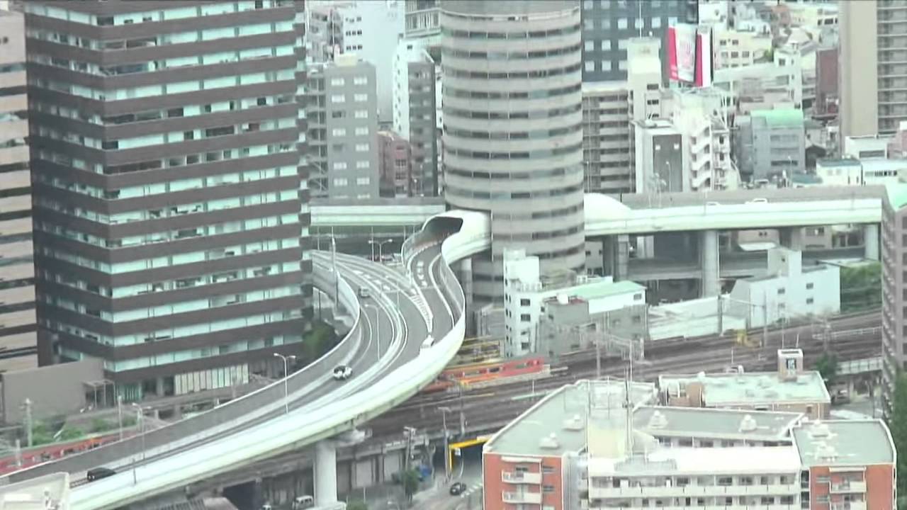 Hanshin Expressway going through Gate Tower Building