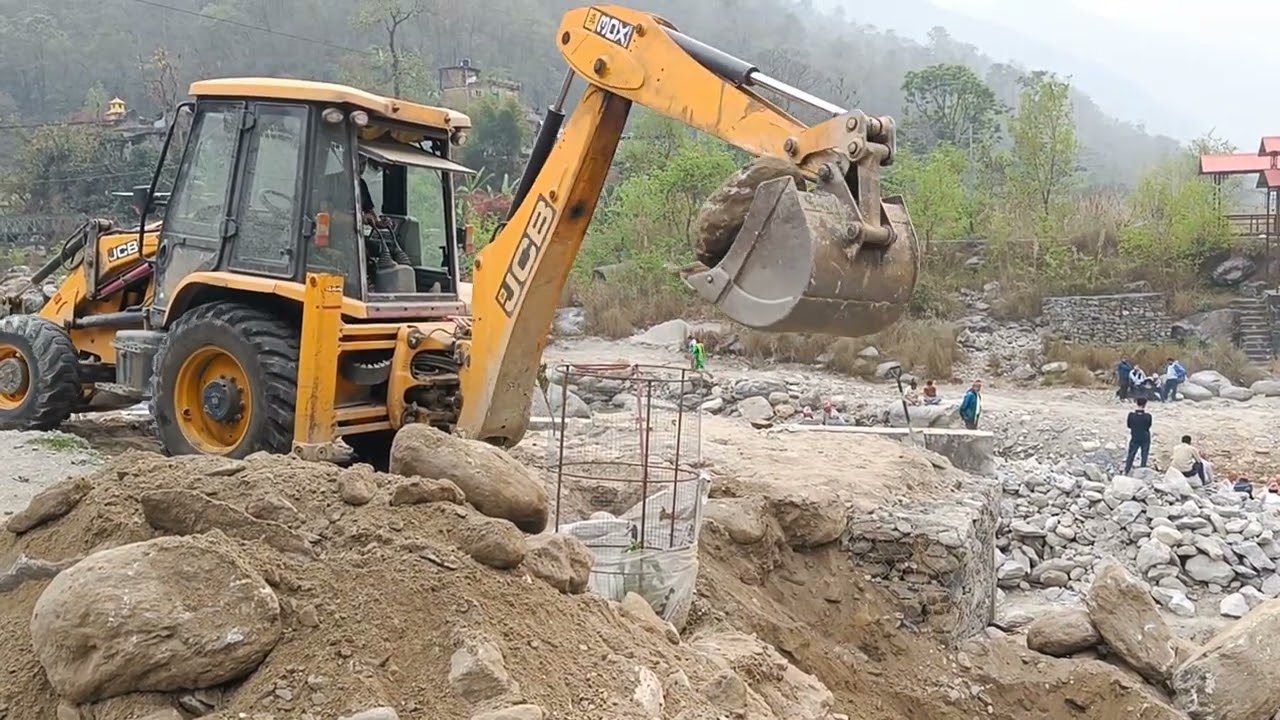 Earthwork in excavation by JCB at Sunkoshi Sindhupalchok. 