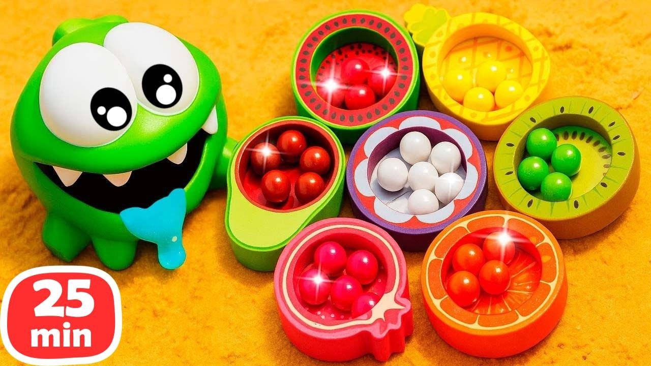 Om Nom busca bolitas de colores y juega con frutas