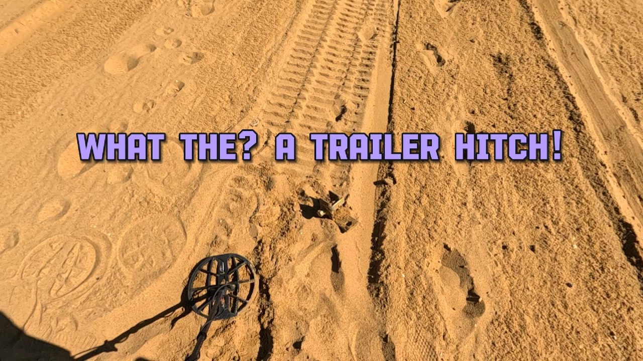 A trailer hitch and a silver ring.