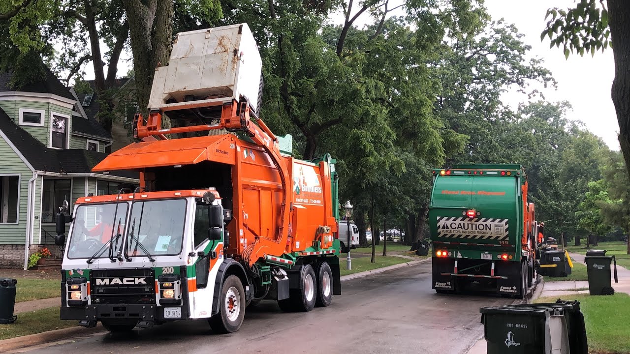 Flood Brothers Garbage Trucks Hustling To Finish A Wet Recycling Route