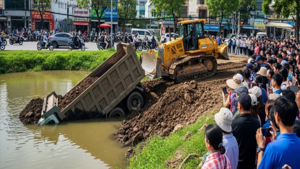 Unloading Soil Fail Dump Truck Overturned Into water And Help By Skill Bulldozer