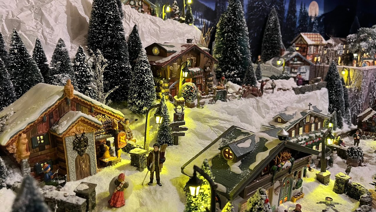 Village de Noël Luville et montagne enneigée 