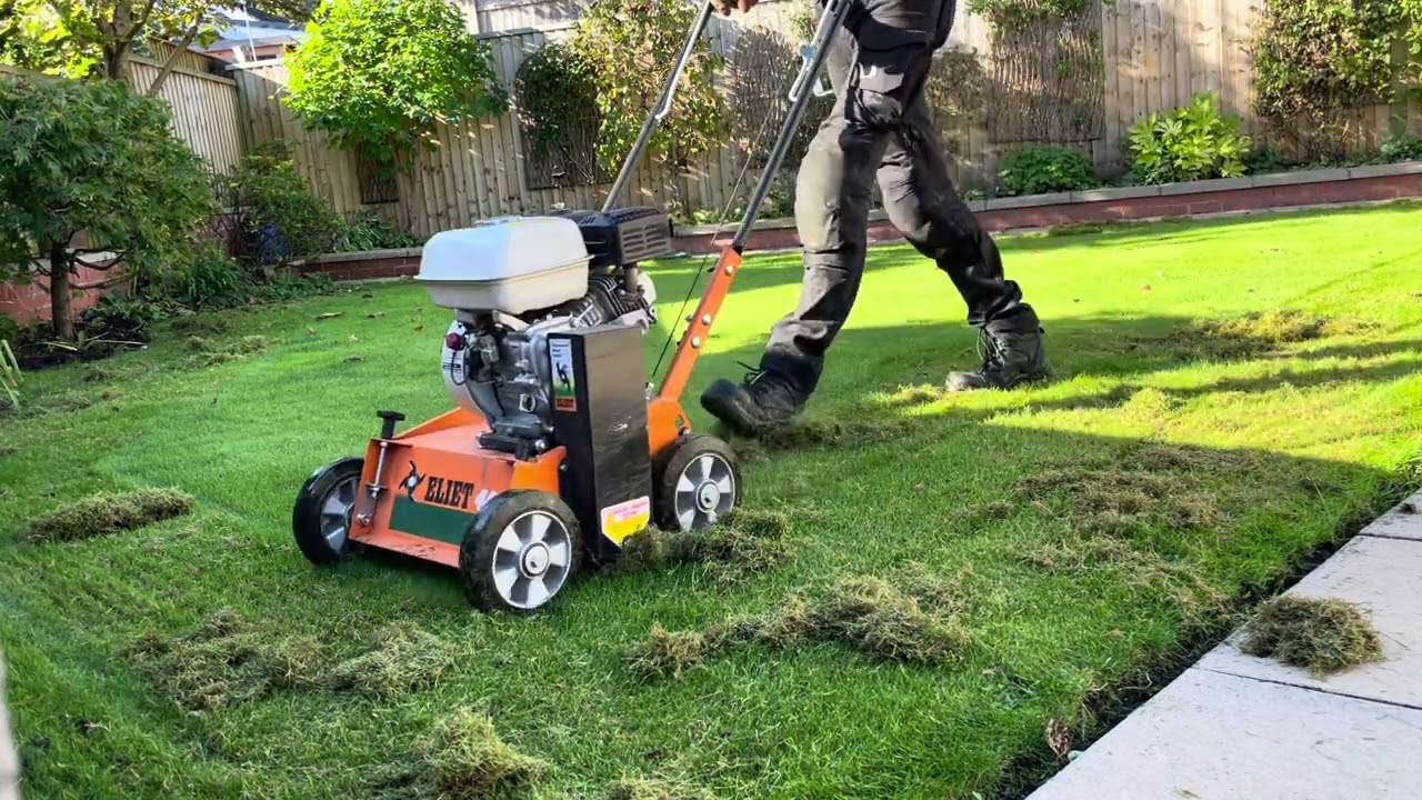 Lightly scarifying a lawn in Derbyshire.