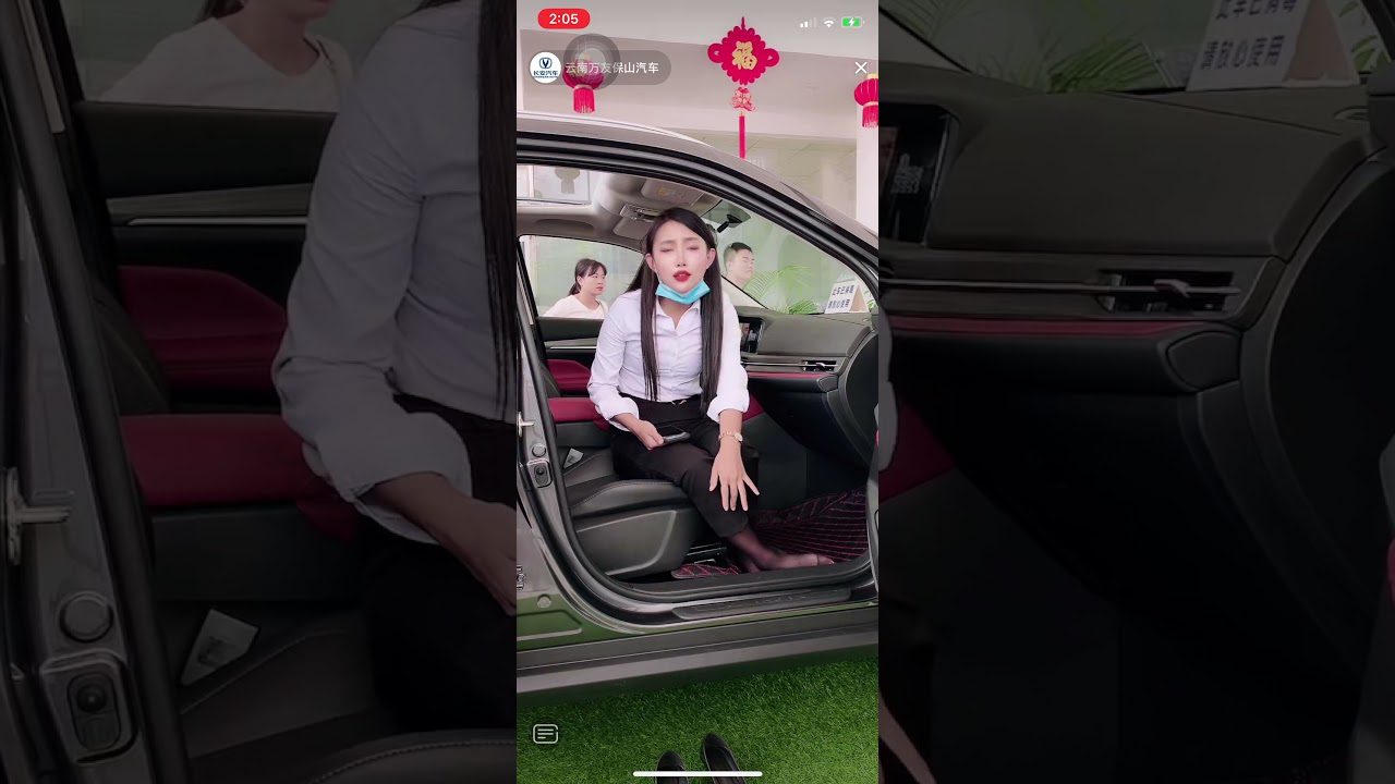 Chinese girl shoe off and show her black nylon feet in car