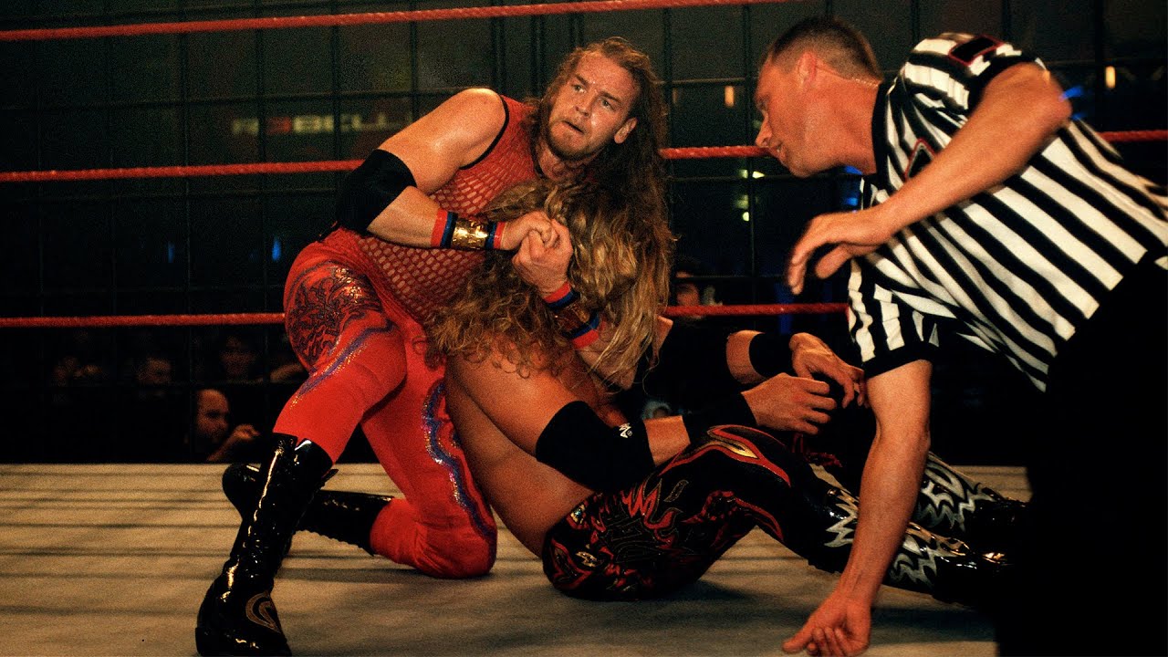 Edge battles Christian inside a Steel Cage: WWE Rebellion 2001