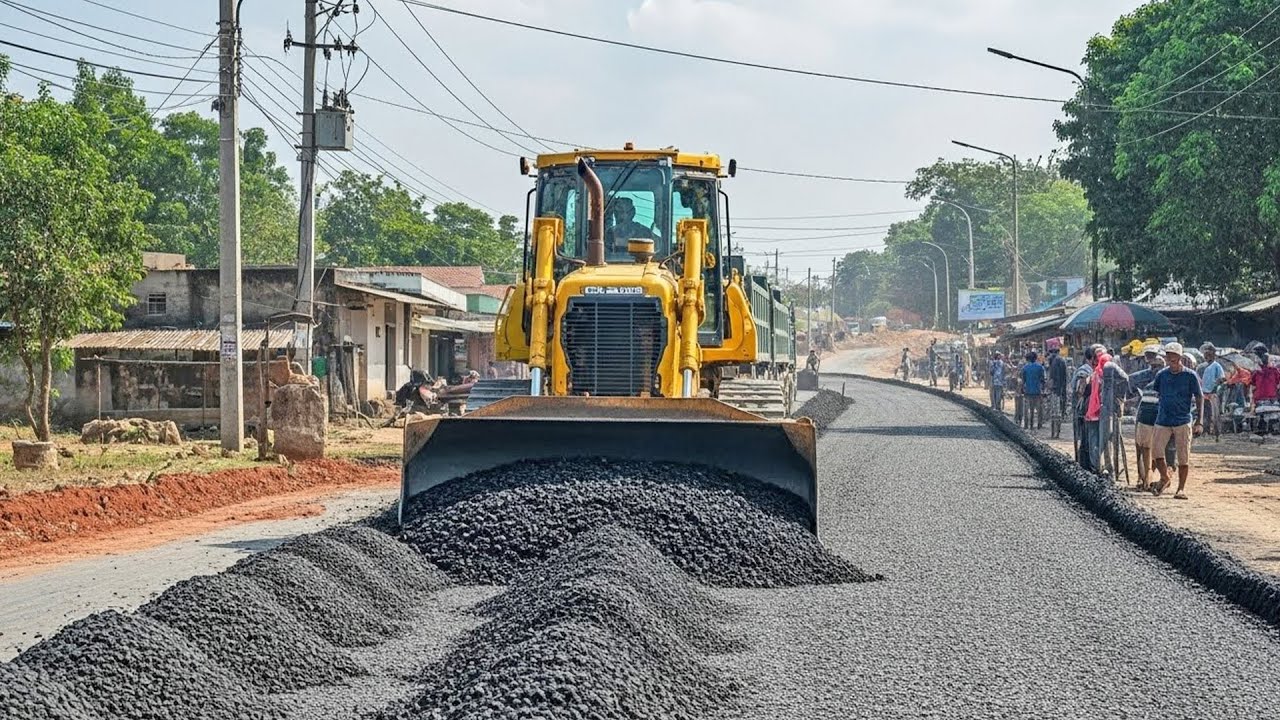 Bulldozer Spreading Gravel on Rural Road Construction