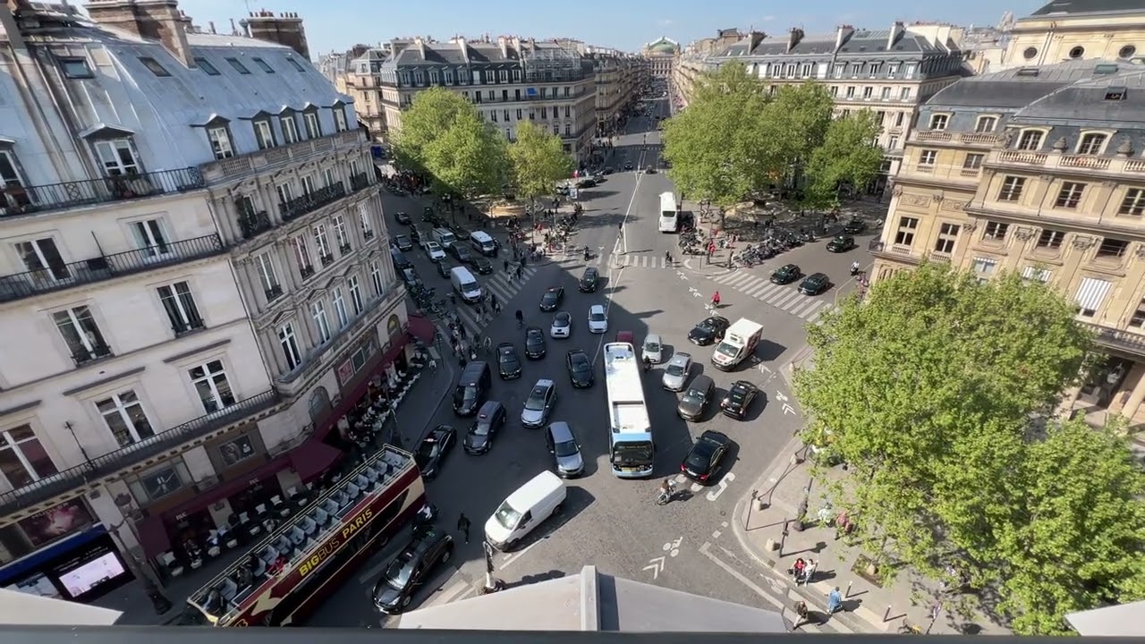 Paris traffic, Hotel du Louvre, Paris, France.