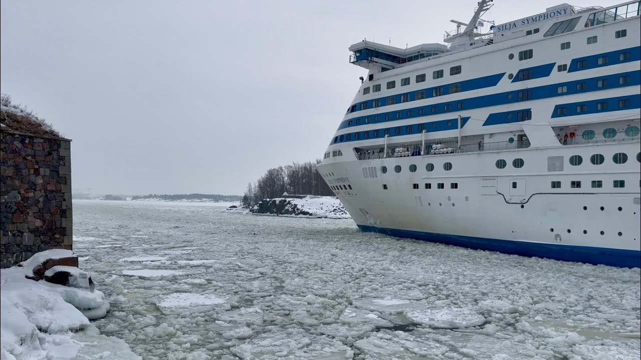 A giant ferry navigates through very narrow and shallow Kustaanmiekka strait, Helsinki, Finland.